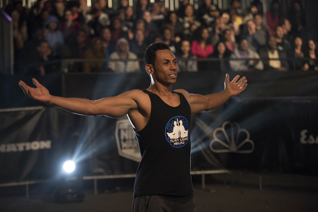 Chris Workman standing victorious on the American Ninja Warrior stage